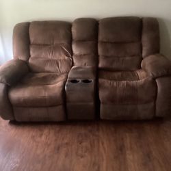 A Reclining Love Seat With  Storage For Remotes Etc.  FREE!
