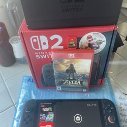 Nintendo Switch 2 W/  Zelda Breath Of The Wild Physical Copy And Digital Copy Of Mario Kart World