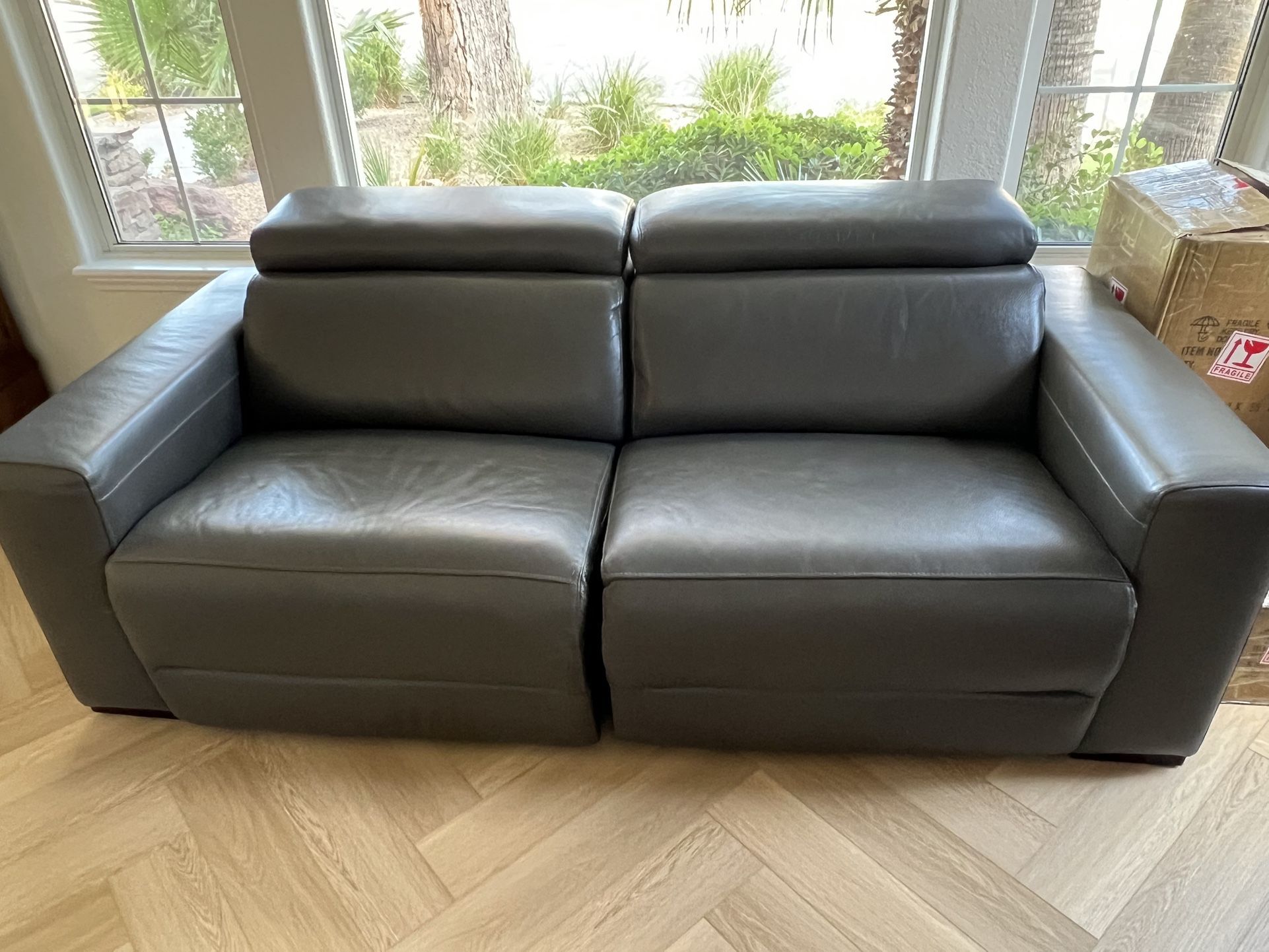 Nearly New Leather Loveseat With Double Recliners
