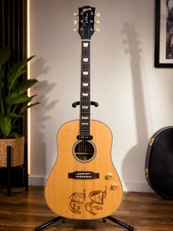 Chibson Lennon-style J-160E acoustic/electric guitar with built-in P90 pickup