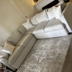 L shaped couch with pillows 