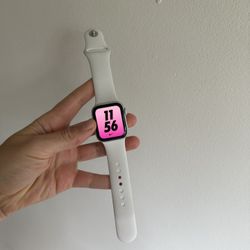 Apple Watch SE with a white sport band+ The Apple AirPods (2nd Gen)