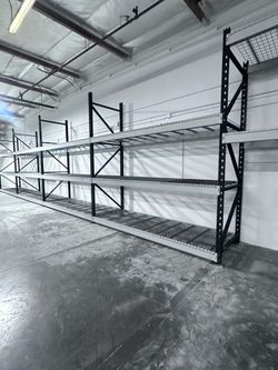 Black  & grey pallett rackin.   42”deep 6’to12” tall    8’ wide 3 shelves 400$.  4 shelves 500$
