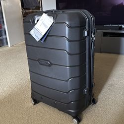 Samsonite checked large spinner luggage