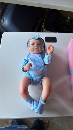 Realistic baby doll that’s a girl and is in good condition