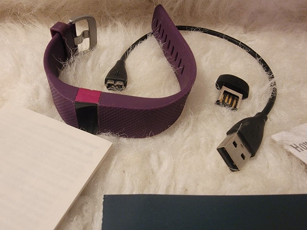 Plum Colored Fitbit Heart Rate Wireless Activity Wristband and wireless activity tracking. 