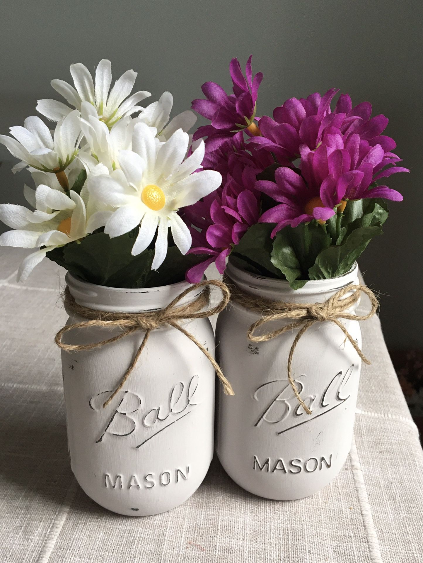 Distressed mason jar vases with flowers included!! Jar/flower choices shown in photos $12 for both