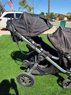 City select by Baby Jogger double stroller with kickboard.