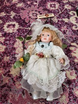 Swinging Porcelain Doll