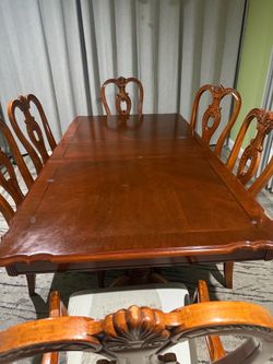 Table with 6 chairs and china cabinet