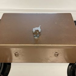 This is a vintage Rockaway heavy metal cash lockbox.  Made by Rockaway Metal Products Corp., located in Inwood, L.I., N.Y.  It is a durable, heavy-dut