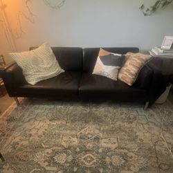 Brown faux leather sofa