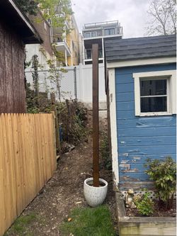 Concrete base wooden post