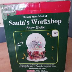 NEW IN BOX CHRISTMAS COLLECTIBLE CRAFTSMAN SANTA'S WORKSHOP MUSICAL SNOW GLOBE, ORIG. PRICE $35,  A USED 1 IS LISTED ON POSHMARK FOR $25