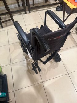 Transporting wheelchair
