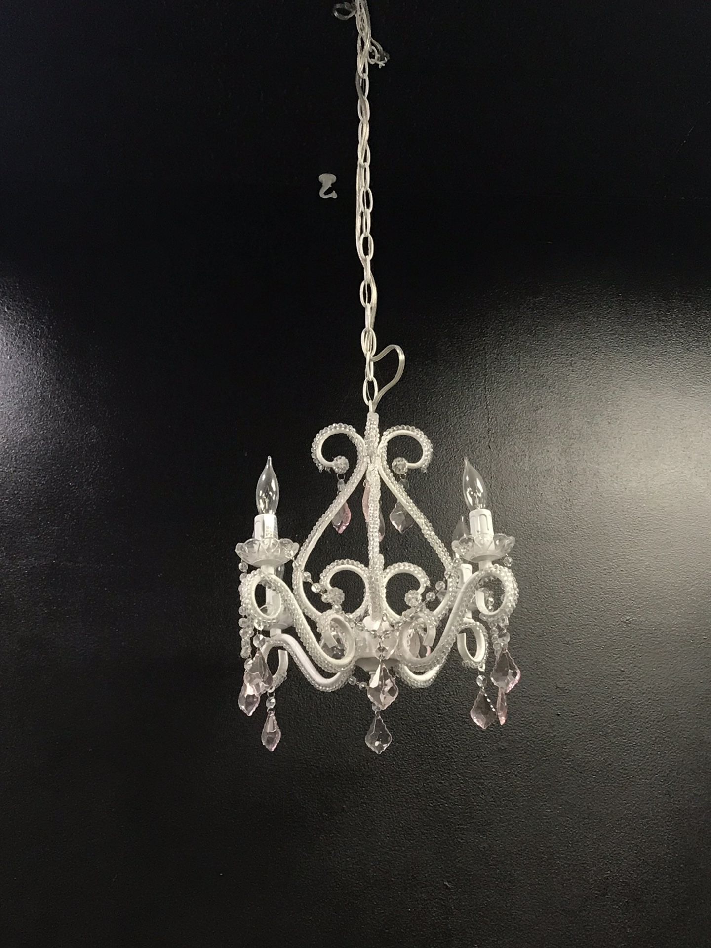 Small chandelier with a lil bit of pink