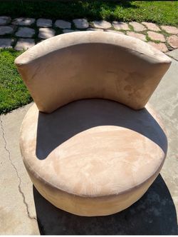 Tan swivel chair