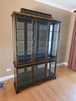 Drexel Heritage "Et Cetera" Chinoiserie China Cabinet features hand-painted detailing on a black lacqu