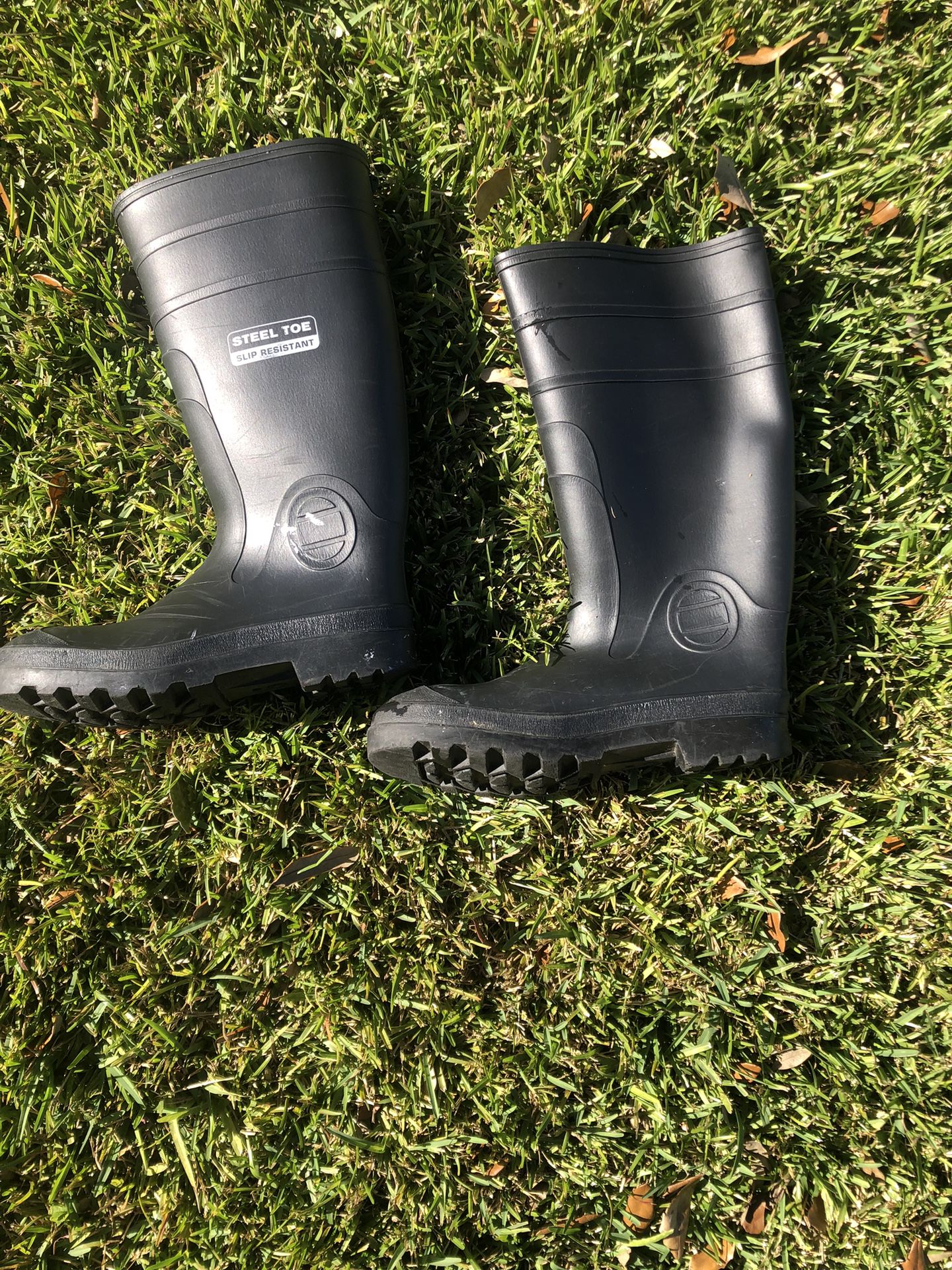 Steel-toe, black rubber boots, size 10