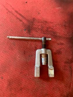 This is a heavy-duty, forged steel yoke for a tube flaring tool, used to securely hold tubing while creating flares.