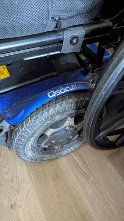 Electric wheelchair mobility aid