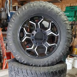 Truck Tire And Rims With The Caps 