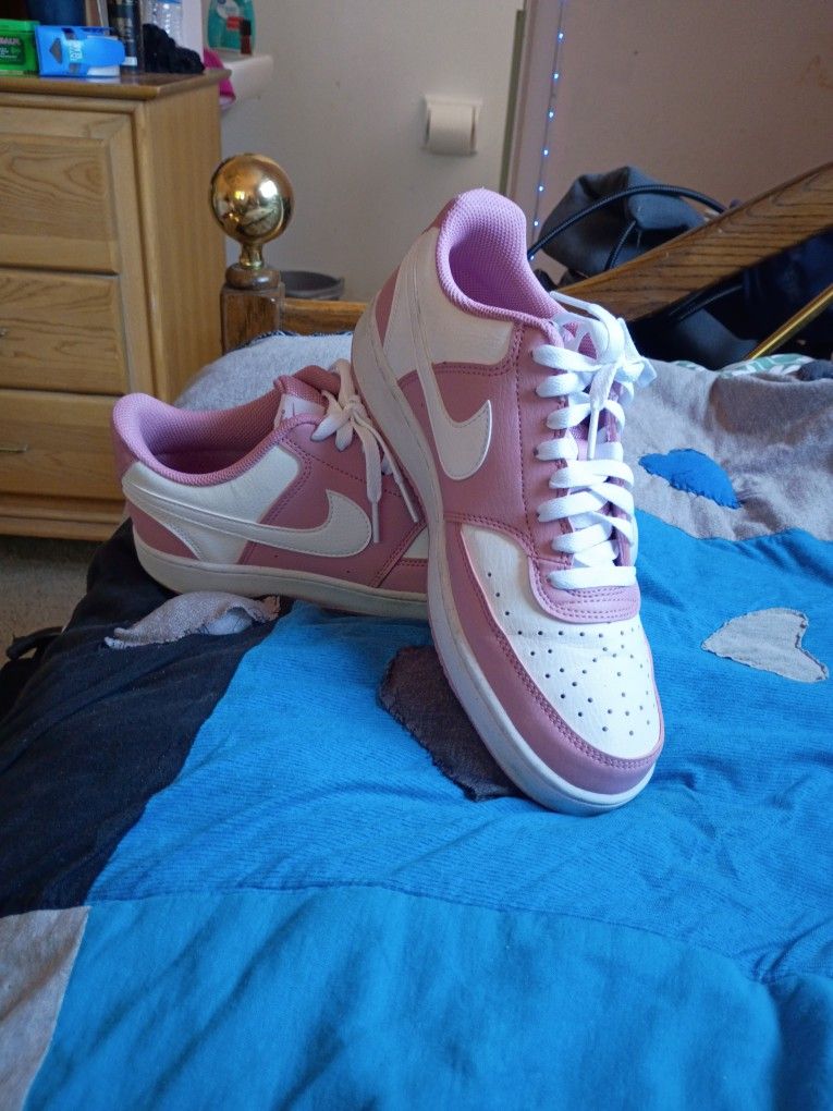 Woman's Pink And White Nikes