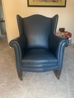 Blue leather wing back chair
