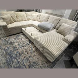 beige Jumbo corduroy storage chaise sectional sofa with pullout sleeper bed 
