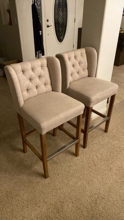 Two barstools 42” height fabric seats nice