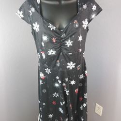 Small Christmas themed black dress 
65% cotton and 35% polyester