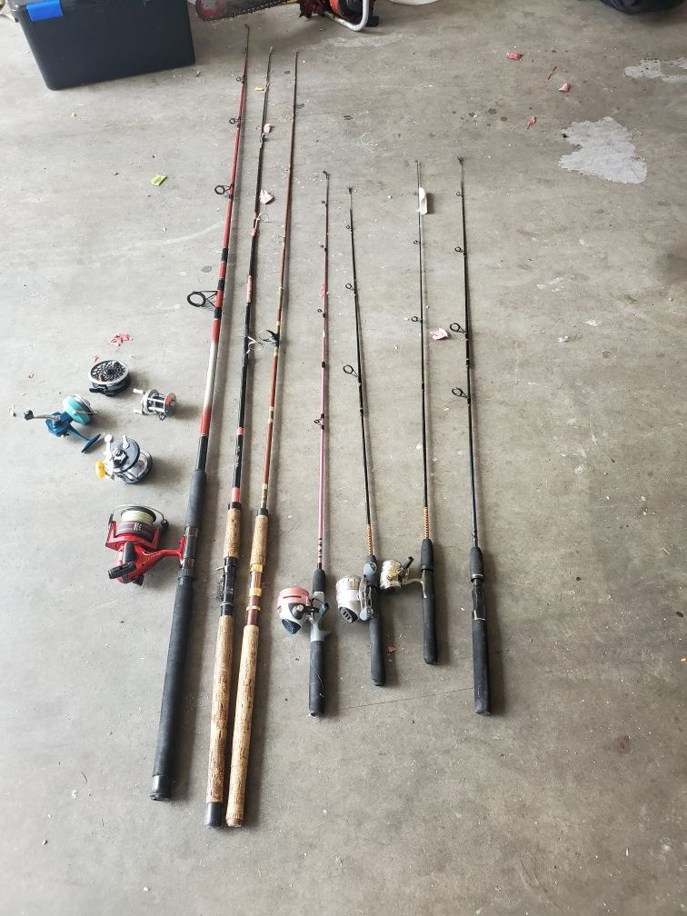 7 fishing poles and reels