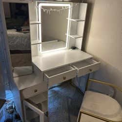 White And Gold Vanity With Outlet