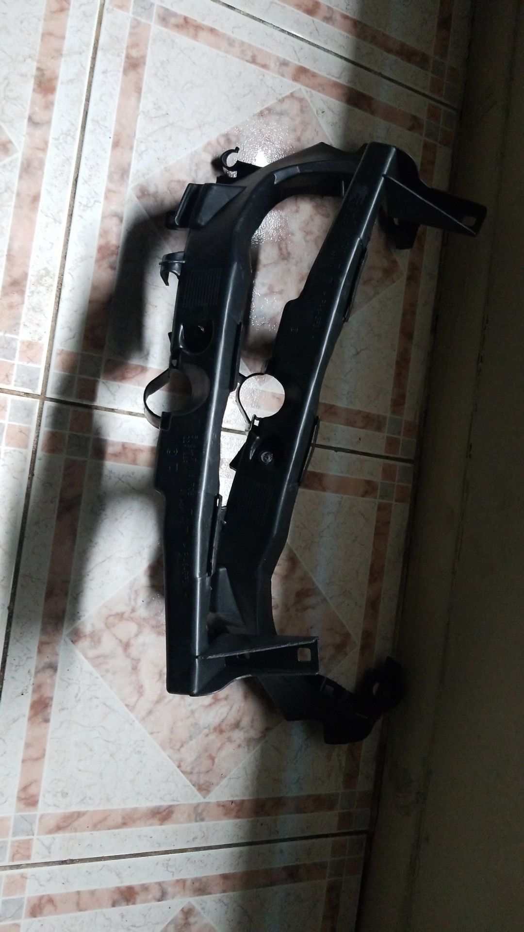 Bmw 335i sedan headlight Bracket