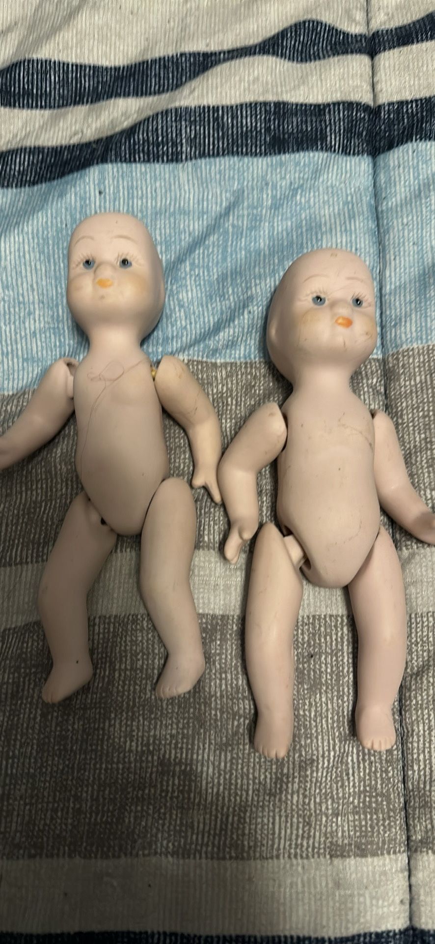 These are vintage porcelain dollhouse baby dolls, likely from the 1950s–1980s. Common brands: Shackman or Heidi Ott style.