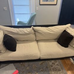 Dania couch. Black wood frame cream cushions 