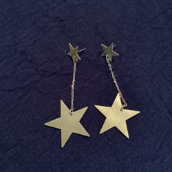 Gold star drop earrings. No backs.