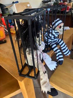 Halloween Animated Skeleton Figures in Cages
