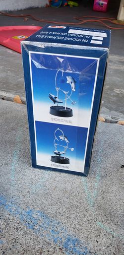 Magnetic swinging Dolphin display