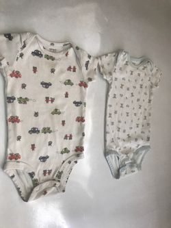 Two Carter’s onesie Size 9 Months