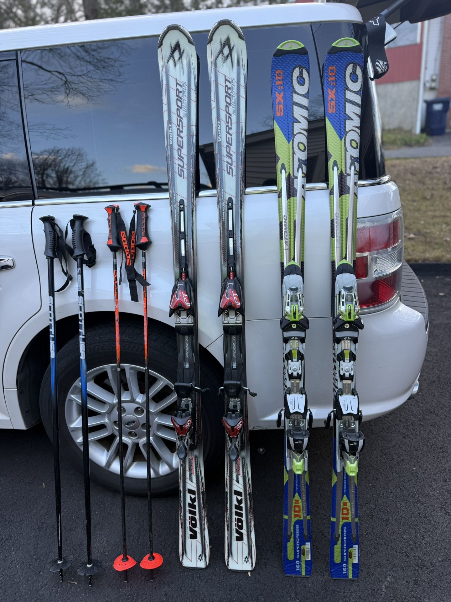 Volkl and Atomic skis with the poles