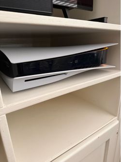 Sony PlayStation 5 with two controllers and dual charger dock