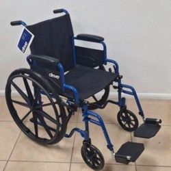 Wheelchair with Swing-Away Footrests and Flip-Back. Arms