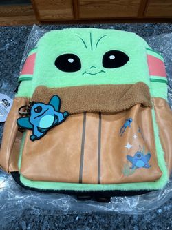 Star Wars The Mandalorian Grogu Fuzzy Backpack, featuring a plush, fuzzy green exterior and a front pocket styled to look like his hovering pram, comp