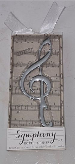 Symphony treble clef metal bottle opener,5 inches long,3 inches wide,brand new in original gift box,looks like a decorative music ornament but works a