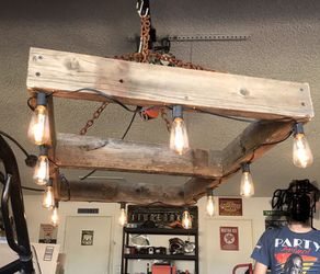Reclaimed wood chandelier, would make a great pool table light or over a dining room table
