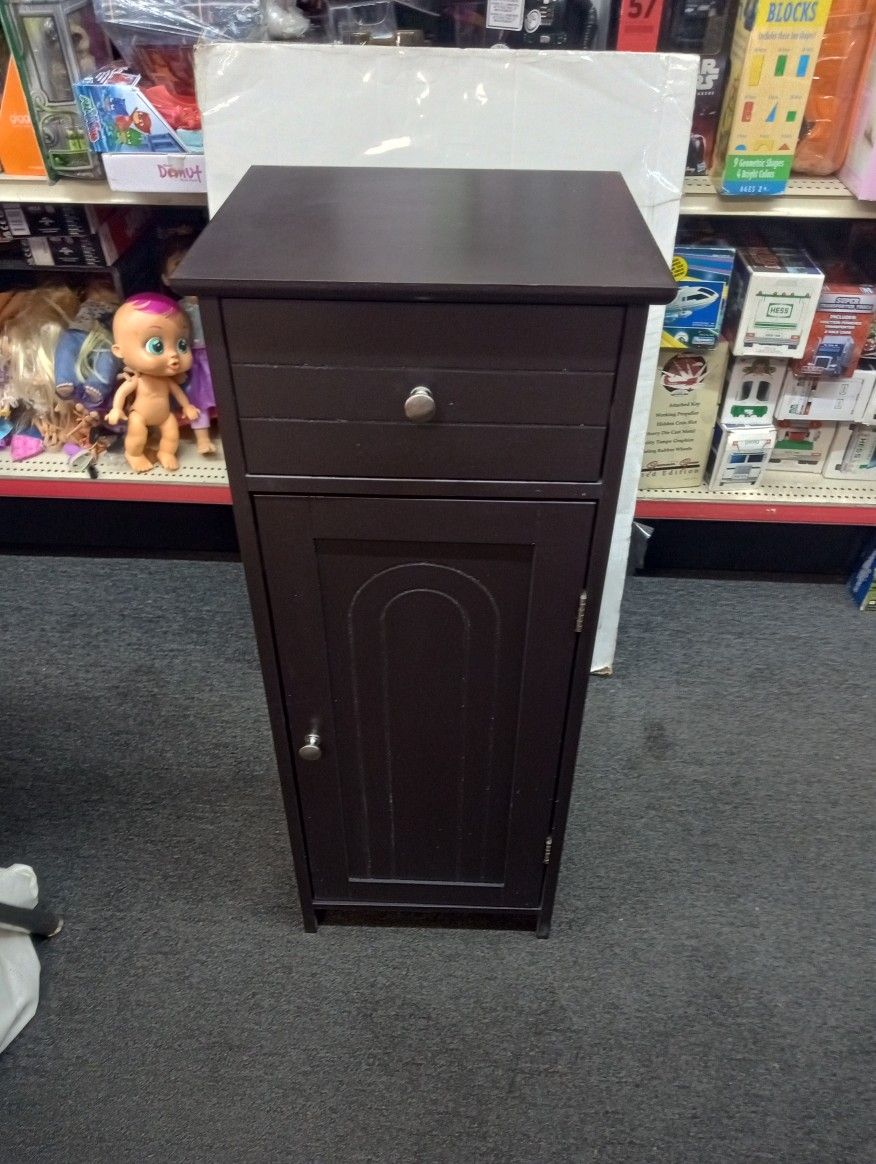 Small cabinet fits almost anywhere has three shelves and a drawer 14x12x34"H