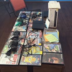 Ps2 two both tested original box multiple games and 4 controls and Memory card plus 1 set of wires Tested works can see working as well willing to mee