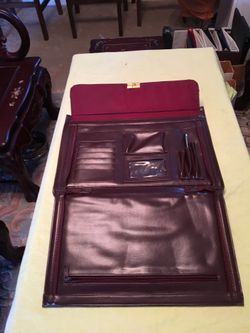 The leather bag ( plums color) long 16 inches width 12 inches