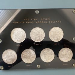The First Seven Morgan New Orleans Silver Dollars.